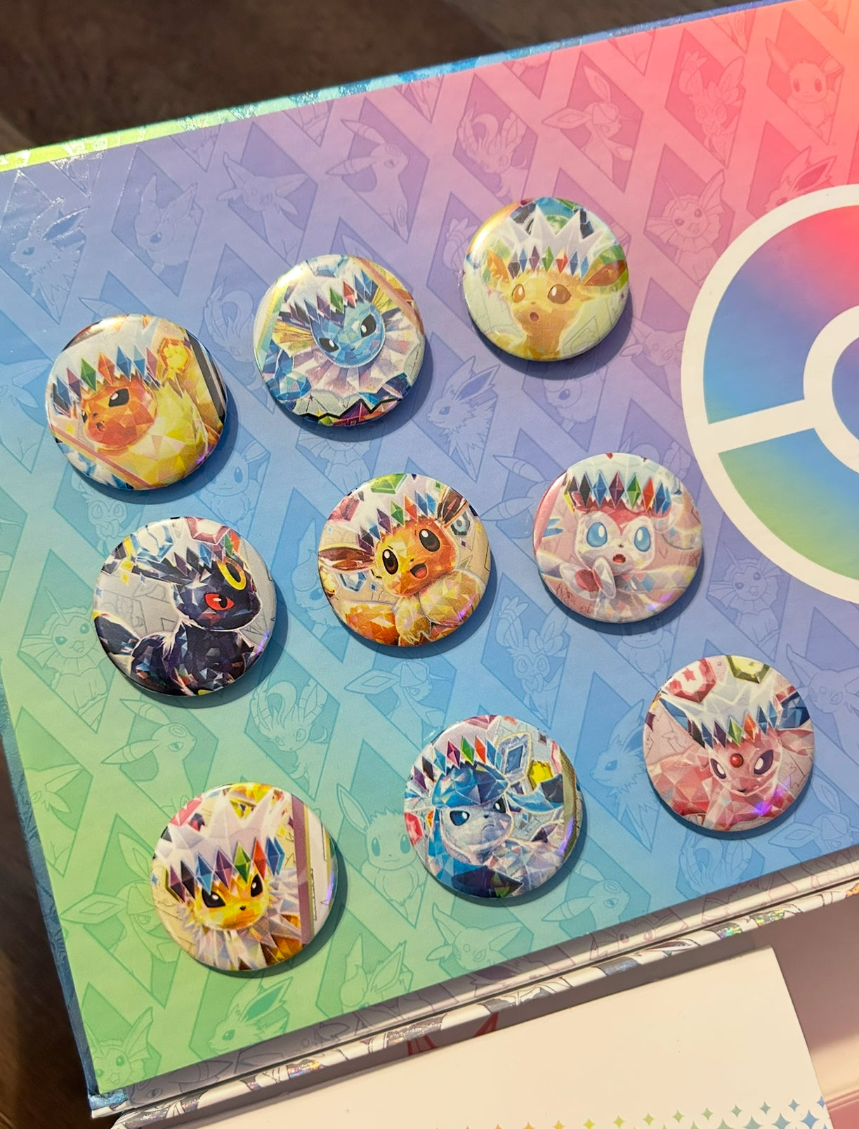 Recycled prismatic evolution Pokémon wrap into buttons -set of 9